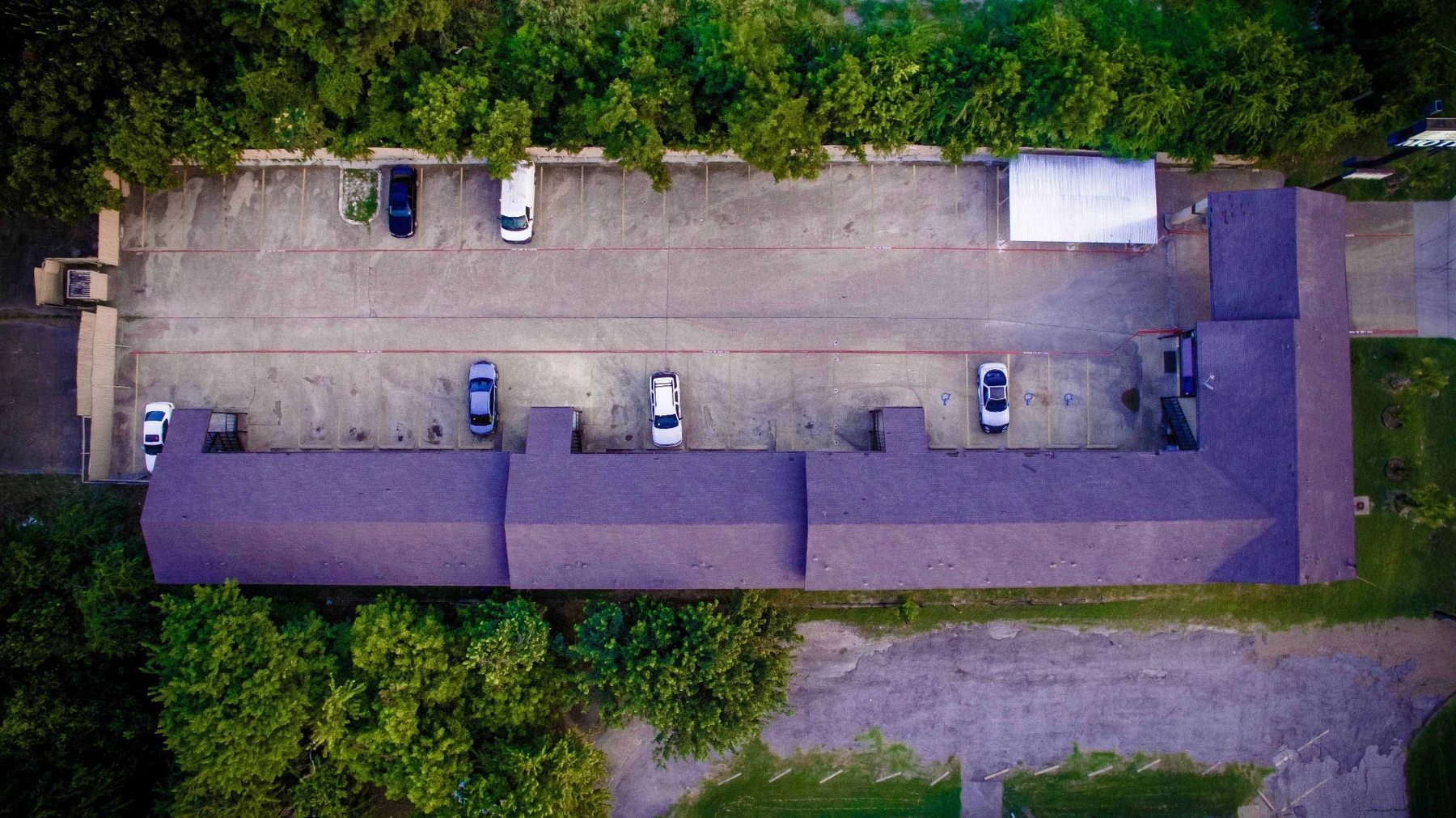 Top-down drone view of Luxury Inn Dallas property
