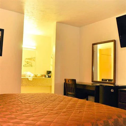 King room with desk, mirror and vanity area